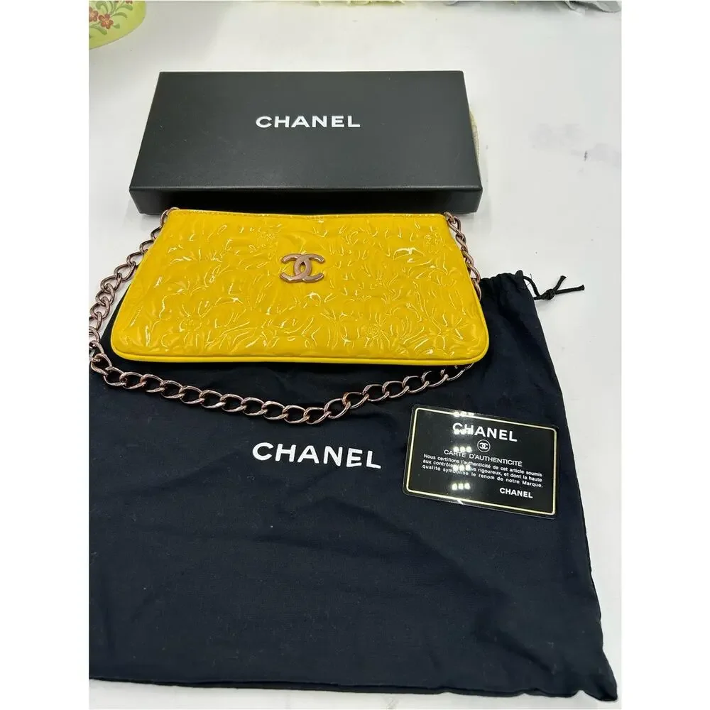 Women's Chanel patent leather floral embossed shoulder bag made in Italy